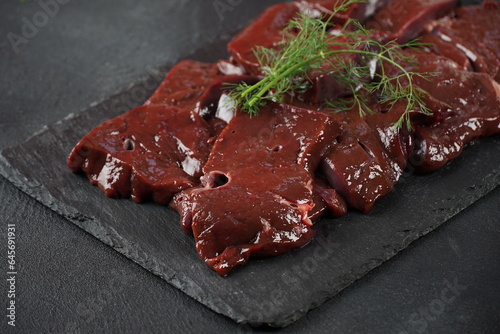 Fresh Raw beef liver on a slate board