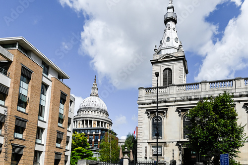 London, UK, 15 August 2023: St Nicholas Cole Abbey, Queen Victoria Street, St Paul’s Cathedralin the background, London