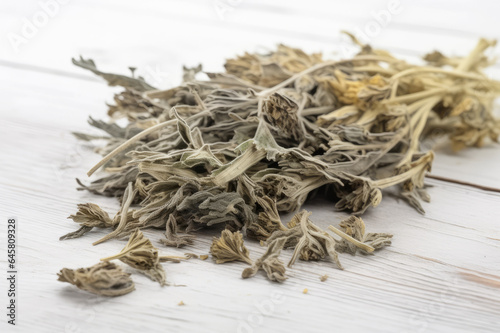 Wormwood Medicinal Herb Dried on White Wooden Background