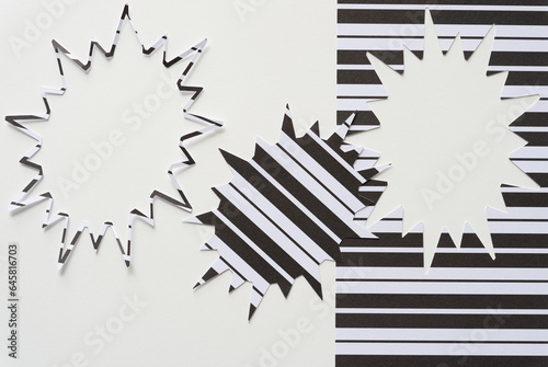 thin starburst frame, starburst cutout, and stencil from which said shapes were machine-cut from black and white paper with lines