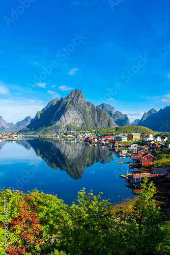 Perfect reflection of the Reine village on the water of the fjord in the Lofoten Islands, Norway