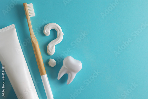 Toothpaste question mark on a colored background. Dental care, oral health.