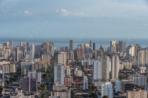 City of Santos, Brazil. Aerial view of the city. Ana Costa avenue on the right crossing the neighborhoods of Vila Mathias, Campo Grande and Gonzaga. In the background the sea and ships on the horizon.