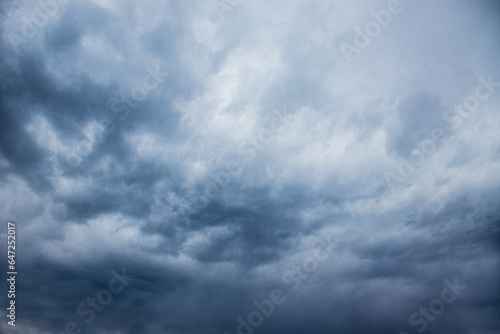 dark stormy sky, dark clouds, dark sky with converging heavy clouds and violent storm before rain, sky and environment of bad or gloomy weather, carbon dioxide emissions, greenhouse effect, global war