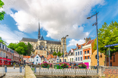 Amiens cityscape old town Saint-Leu quarter with multicolored houses and Amiens Cathedral Basilica of Our Lady in historical city centre, Somme department, Hauts-de-France Region, Northern France