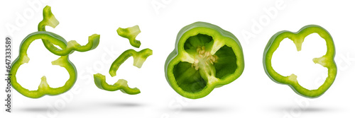 Set of green paprika cloves on a white isolated background close-up. Paprika of different sizes fall, casting a shadow, for insertion into a design or project