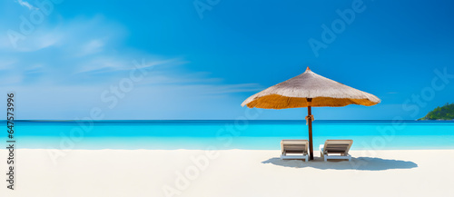 two chairs with an umbrella sitting on the beach