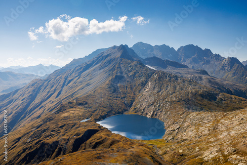 alpine lake of Lago Retico at the boarder of Ticino and Surselva, Switzerland