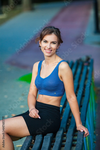 Athletic young woman in sportswear jogging in the park. Fitness and healthy lifestyle. Portrait of a beautiful young woman in sportswear outdoors. Sport fitness model caucasian ethnicity training outd
