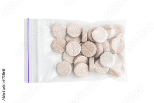 Round therapeutic pills or drugs for treatment in transparent plastic bag isolated on transparent background, medicine and healthcare concept, top view