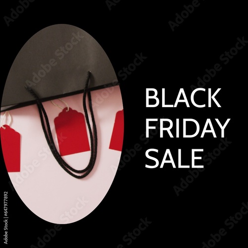 Black friday sale text with shopping bag and red tags on black background