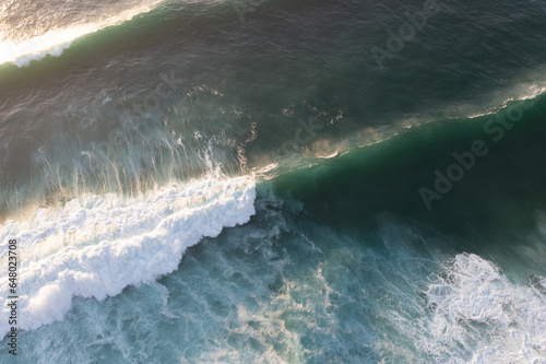 Aerial view of the white beach with waves Big ocean wave Versatile use. Holiday concept