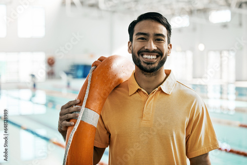 Lifeguard portrait, swimming pool and man with safety and lifebuoy for rescue support, help or life saving. Smile, equipment and first aid expert for protection, security and medical emergency