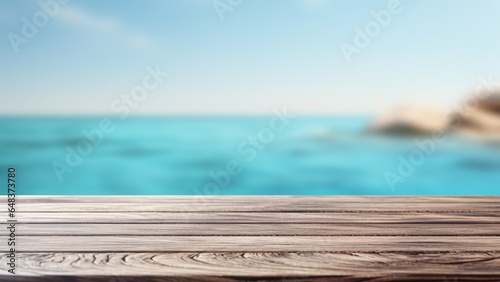 Wooden deck table top on blurred sea background - can be used for display or montage your products