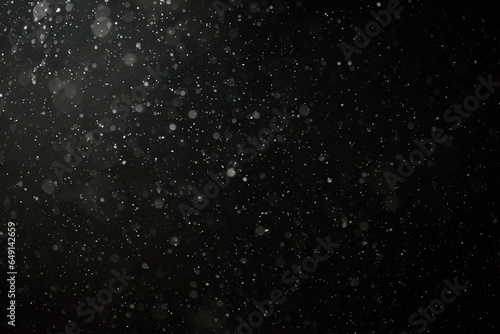 White snow isolated on dark background. Snowflakes falling down. Overlay effect for winter composition