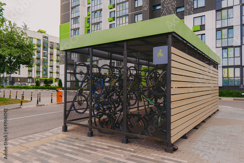 Bicycle garage. Bicycles in a cage on the street. Special garage-cage for bicycles. Bicycle storage device.