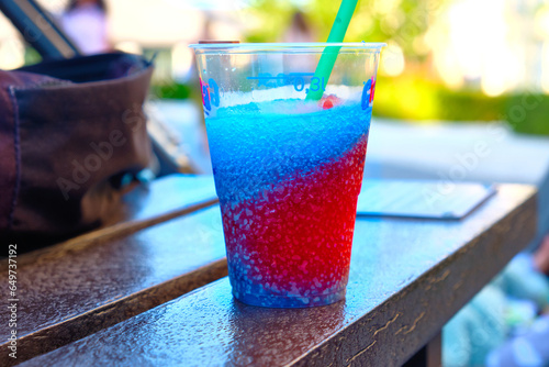  Having a slush puppy drink outside.