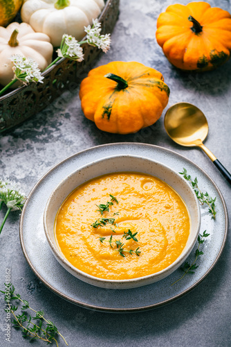 Pumpkin soup with pumpkin seeds served in bowl