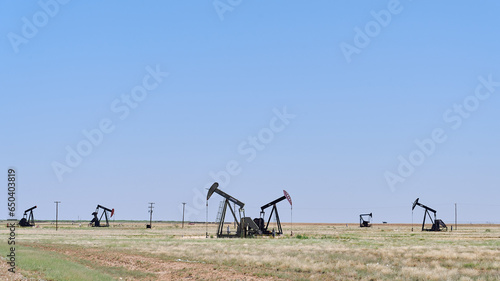 MIDLAND, TEXAS/USA - JULY 4th 2023: oil rig fields. a road trip of a family with a teenage girl during her school summer break before the start of the senior year.