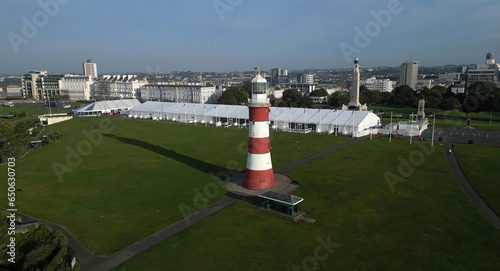 Plymouth, Devon, England: DRONE VIEW: Smeaton's Tower on Plymouth Hoe. Designed by John Smeaton, the lighthouse operated from 1759 to 1877. Plymouth is a busy UK port and naval base.