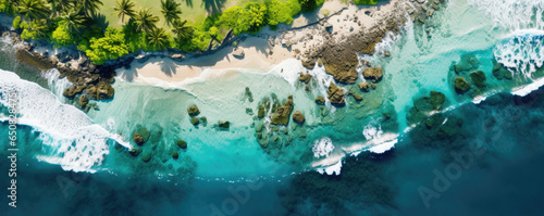 Drone shot of a remote tropical island, featuring turquoise waters, palm-fringed beaches, and coral reefs from above