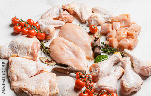 various parts of chicken cut up and ready for cooking