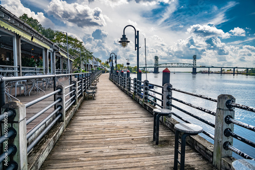 Riverwalk along the waterfront of the Cape Fear River overlooking Memorial Bridge Wilmington, NC