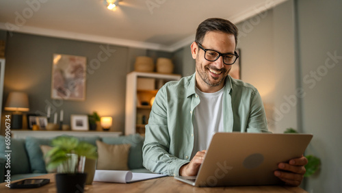 one man adult caucasian work on laptop at home happy smile