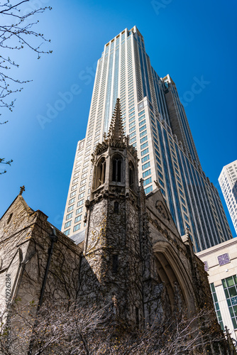 presbyterian church. gothic architecture of church with skyscraper on background. architectural design of the city. church and skyscraper