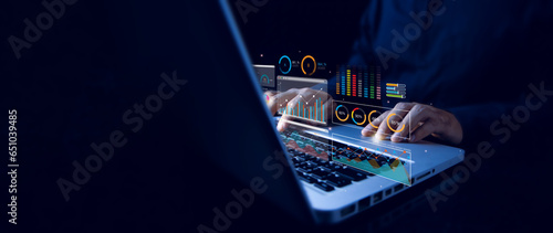 Analyst working with computer in Business Analytics and Data Management System with KPI and metrics connected to the database for technology finance, operations, sales, marketing. Data analysis.Ai