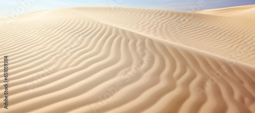 abstract view of a scorching desert day, with sand dunes stretching to the horizon under the intense blue sky.