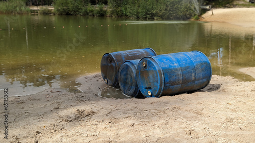 water pollution and environmental pollution by dumping blue waste in this case Drums in the water