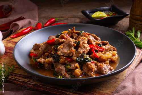 Stir fried sliced Beef with Holy Basil in white plate.Thai famous food (Pad Kra pao)