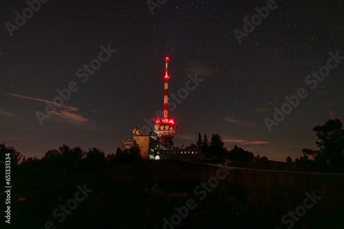 Night view for transmitter on Gaisberg hill over Salzburg city in summer evening