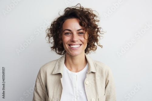 Portrait photography of a happy French woman in her 30s against a white background