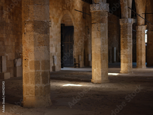 Rhodes, Greece - April 21, 2023: Ancient ruins in the Archeological Museum of Rhodes Town. beautiful old columns in the museum and sun light