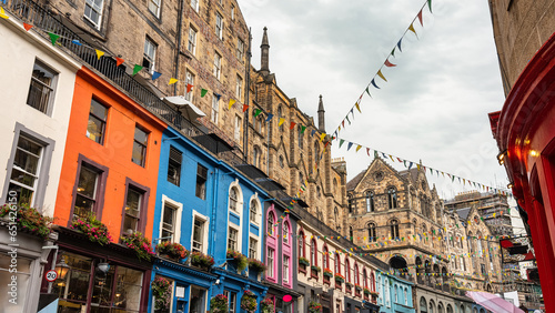 Victoria Street with its medieval houses and shops with brightly colored facades, Edinburgh, Scotland.