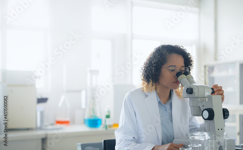 Black female scientist doing research in the laboratory.