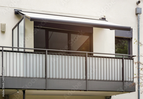 Balcony of Modern Facade Apartment Building. Modern Balcony Awning Marquise, Balcony Railing of Exterior Balcony of Residential House Facade.