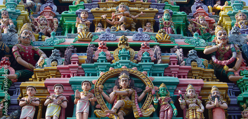 Beautiful idol of Shiva, other gods and saint in one of the tower of Arulmigu Arunachaleswarar Temple, Tiruvannamalai which represent element of fire.