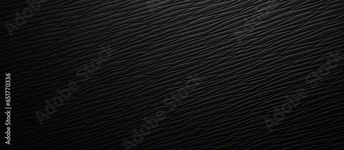 Black plastic textured background zoomed in