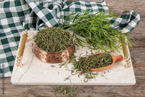 Tarragon or estragon.Fresh and dry tarragon herb. Raw and dry tarragon spice.Tarragon or Artemisia dracunculus.