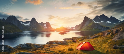Camping in Lofoten Islands Tent amid mountains sunset over polar circle perfect midnight sun landscape