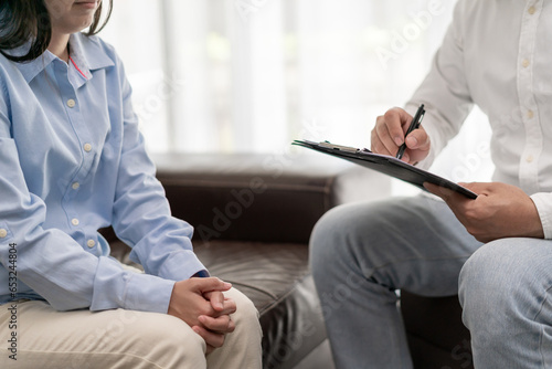 woman with mental health problems is consulting. psychiatrist is recording the patient's condition for treatment. encouragement, love and family problem, bipolar , depression patient, protect suicide