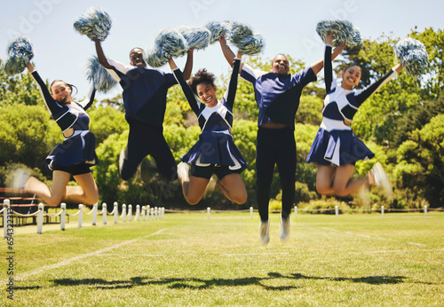 Cheerleader team portrait, people and jump for performance on field outdoor in training, celebration or exercise. Happy, cheerleading group and energy for support at event, sport competition and blur
