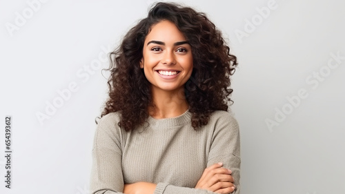 Young Brazilian woman cross arms isolated background looking to the side and smiling