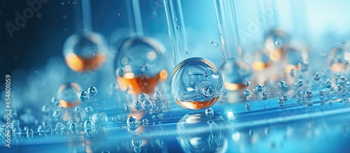 Gel droplets with bubbles enter petri dish in macro shot Concept of hyaluronic acid mixing in face care