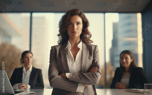 Portrait of a beautiful strong young businesswoman in a suit in the office, strong women concept