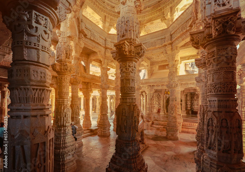 Bas-relief at columns at famous ancient Ranakpur Jain temple in Rajasthan state, India