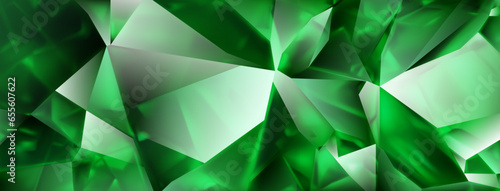 Abstract crystal background in green colors with highlights on the facets and refracting of light